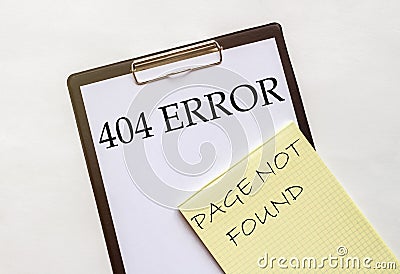 White and yellow paper with text 404 Error Page Not Found on a white background with stationery Stock Photo