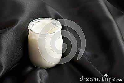 White yoghurt in a bowl on a sheet Stock Photo