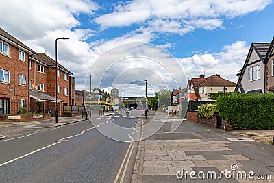 White zigzag road markings on a main street in Greenford, a large town in the London Borough of Ealing in west London, England, Stock Photo