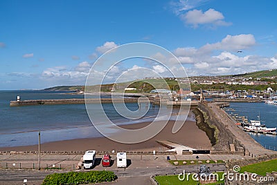 Whitehaven UK harbour walls with motorhomes and campervan parked near the Lake District Stock Photo