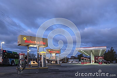 Whitesboro, New York - Nov 01, 2019: Night View of Select-a-Vac Self-cleaning at the Foreground and Speedway Gas Station Pumps at Editorial Stock Photo