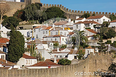 Whitewashed houses within the walled citadel. Obidos. Portugal Stock Photo