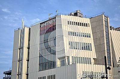 Whitney Museum logo sign on side of famous modern building in lower Manhattan, New York City. Editorial Stock Photo