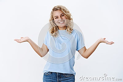 Who cares chill and be happy. Portrait of charismatic carefree young 25s girl with blue eyes tilting head joyfully as Stock Photo