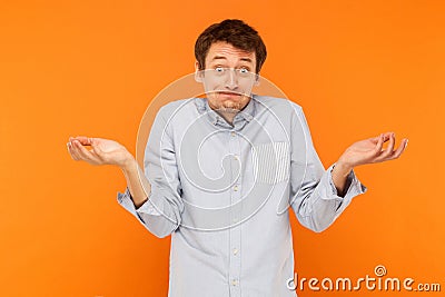 Who know`s. Confused man looking at camera Stock Photo