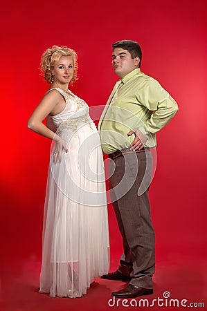 Who's belly larger? Stock Photo