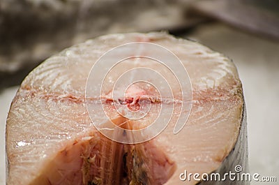 Whole big tuna being cutting and chopped at Sydney fish market. Stock Photo