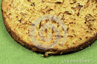 Whole cassava cake on green fabric background Stock Photo