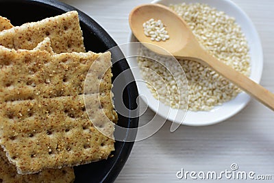 Whole and Chunked Healthy Sesame Soda Crackers Stock Photo