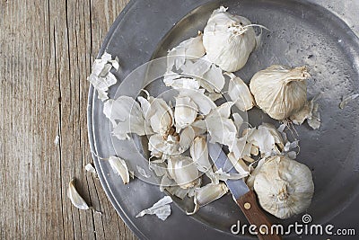 Whole and cloves of organic garlic Stock Photo