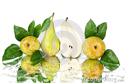 Conference pears with green leaves and one cut pear half on white background isolated close up Stock Photo