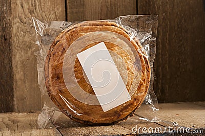 Whole Cooked Pie in Plastic Packaging Stock Photo