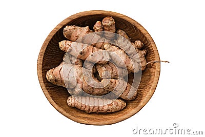 Whole curcuma roots in bowl. Fresh raw turmeric spice, isolated on white. Top view. Stock Photo