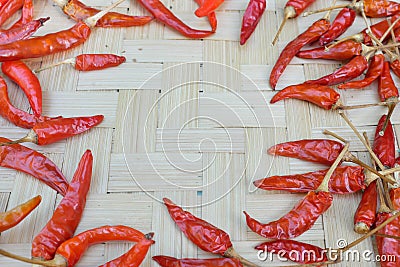 Whole dried red chili or hot pepper top view on natural background with copy space. Stock Photo