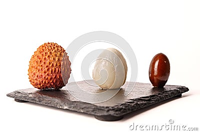 whole fresh lychee, peeled and pitted on white background Stock Photo