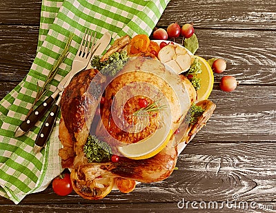 Whole fried chicken glazed, garlic homemade cooked on wooden background Stock Photo