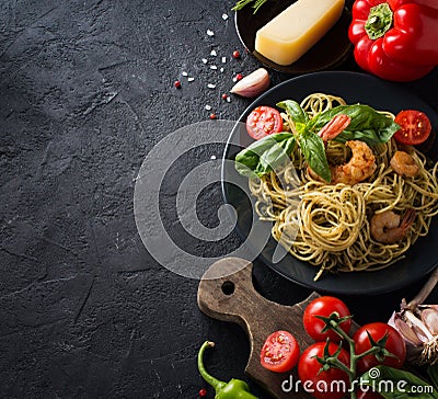 Whole grain spaghetti pasta with shrimp, top view, copy space Stock Photo