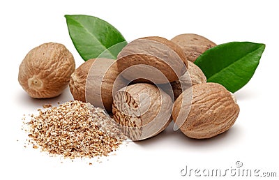 Whole and grated nutmeg with leaves isolated Stock Photo