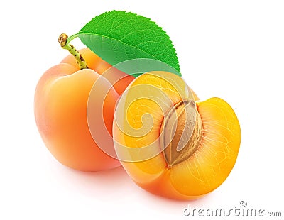 Whole and halved apricot fruit with green leaf on white background Stock Photo