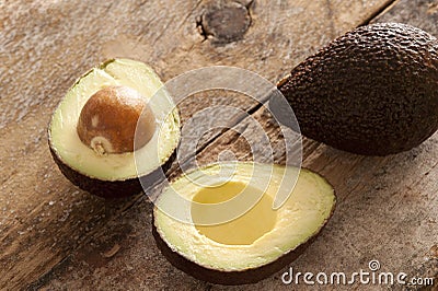 Whole and halved ripe avocado pear Stock Photo