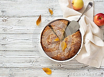 Whole homemade apple pie on white wooden background Stock Photo
