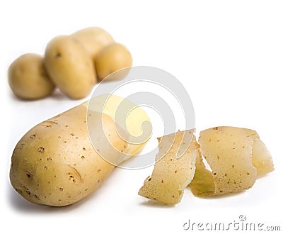 Whole and peeled potatoes Stock Photo