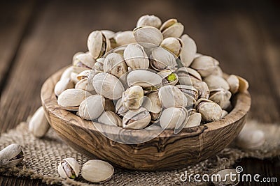 Whole Pistachios on wood Stock Photo