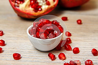 Whole pomegranate, part of pomegranate and pomegranate seeds Stock Photo