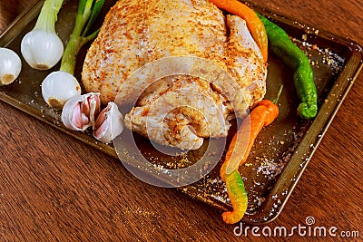 Whole raw chicken seasoned with butter and herbs for roasting. Top view, Stock Photo