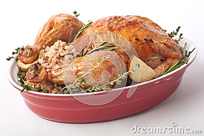 Whole Roast Turkey in a Red Dish Stock Photo