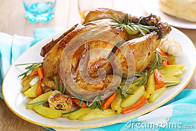 Whole roasted chicken with vegetables Stock Photo