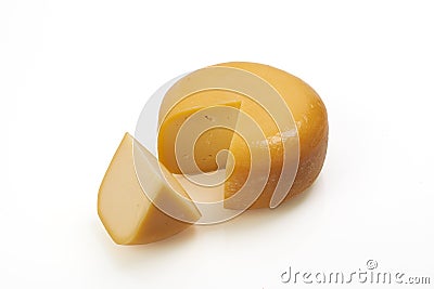 Whole round and one peace of organic produced cheese Stock Photo