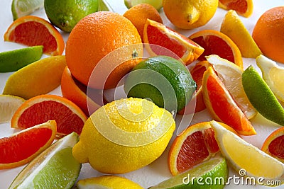 Whole and sliced fresh citrus fruits of oranges,lemons and limes Stock Photo