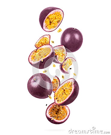 Whole and sliced ripe passion fruit in the air, isolated on a white background Stock Photo