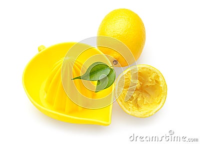 Whole and squeezed lemons with juicer on white background Stock Photo