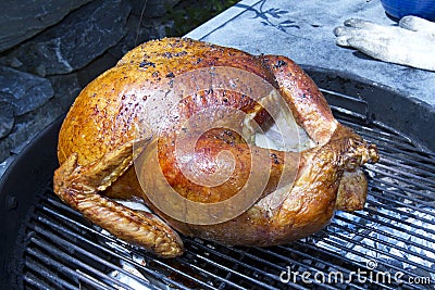 Whole Turkey Roasting on Grill Stock Photo