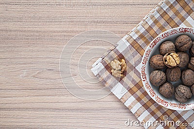 Whole walnuts and walnut kernels from above Stock Photo