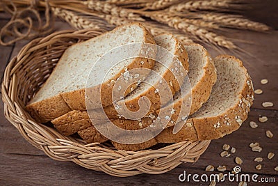 Whole wheat bread in wicker basket Stock Photo