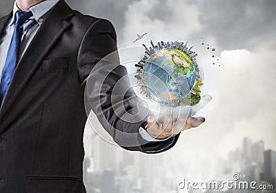 Whole world in his hand . Mixed media Stock Photo