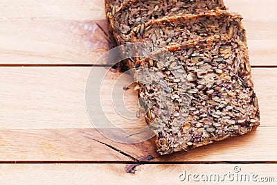Wholemeal, wholewheat bread on wooden table. Organic, healthy food Stock Photo