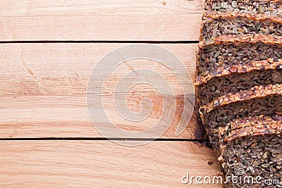 Wholemeal, wholewheat bread on wooden table. Organic, healthy food Stock Photo
