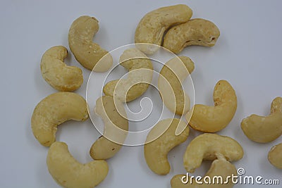 Wholesome and healthy food, natural nuts, large cashew nuts arranged on a white background. Stock Photo