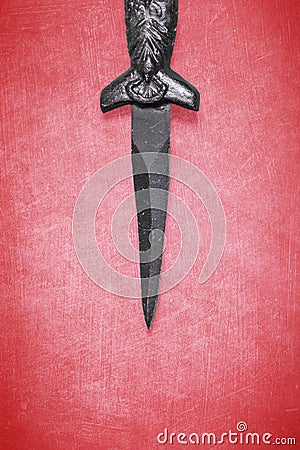 Wiccan dagger on a red background Stock Photo