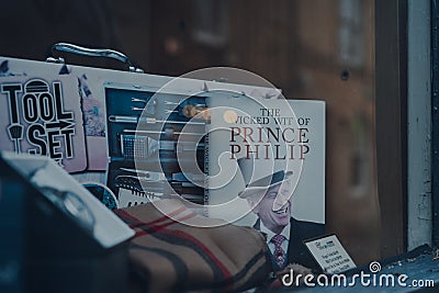 The Wicked Wit of Prince Philip book on a window display of a shop in Stow-on-the-Wold, Cotswolds, UK, selective focus Editorial Stock Photo
