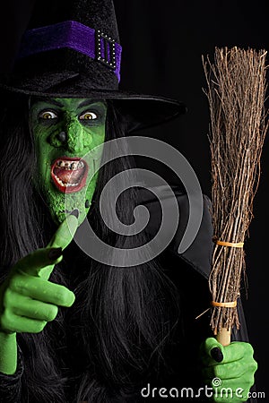 The wicked witch and her broomstick. Stock Photo