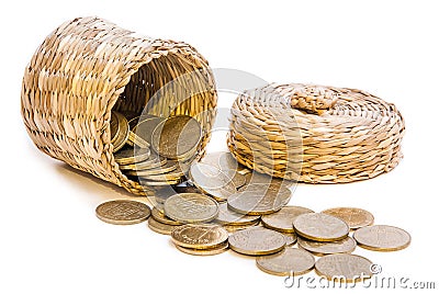 Wicker basket with coins Stock Photo