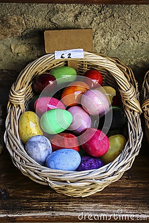 Wicker basket with Easter eggs of different colors Stock Photo