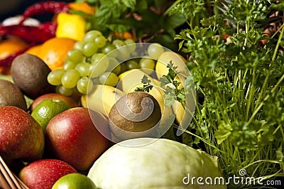 Wicker basket with fruit and vegetables Stock Photo