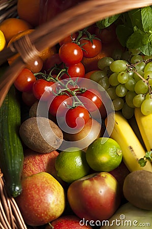 Wicker basket with fruit and vegetables Stock Photo