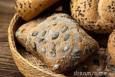 Wicker basket with selection of breads and pastries. Assortment of baked products Stock Photo